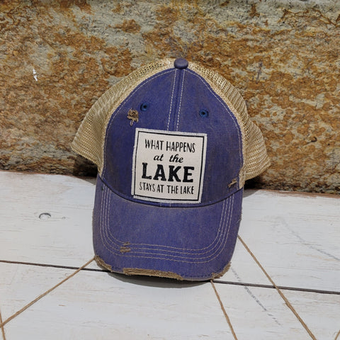 What happens at the lake stays at the lake distressed trucker cap